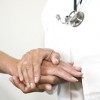 How Ill-Health Affects Your Chance of Buying an Equity Release Doctor holding hand